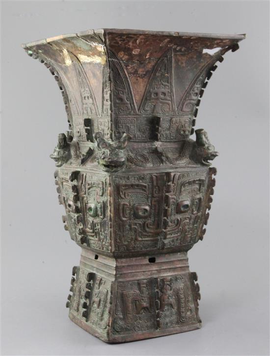 A rare Chinese archaic bronze ritual wine vessel, Fangzun, Shang dynasty, 13th-11th century B.C., 33.5cm high, losses and repairs